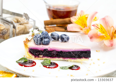 piece of blueberry pie on a table in a restaurant piece of blueberry pie on a table in a restaurant 13303637
