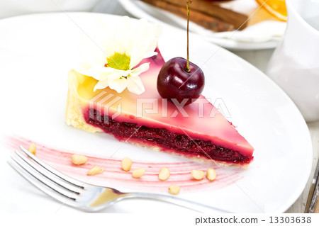 piece of cherry pie on a table in a restaurant piece of cherry pie on a table in a restaurant 13303638