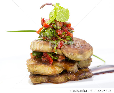 Roast goose liver is decorated with greens and strawberries Roast goose liver is decorated with greens and strawberries 13303802