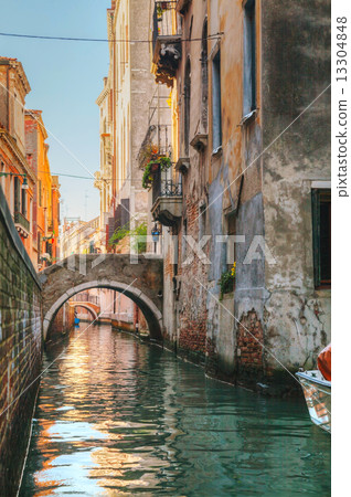 Narrow canal in Venice, Italy 13304848
