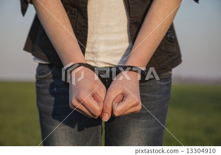 Handcuffed woman's hands Handcuffed woman's hands 13304910
