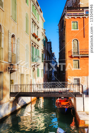 Narrow canal in Venice, Italy 13304946