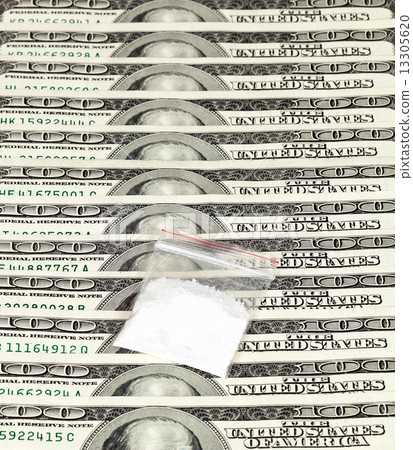Package with drug over the U.S. dollars background 13305620