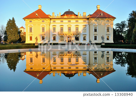Slavkov castle reflected in water 13308940