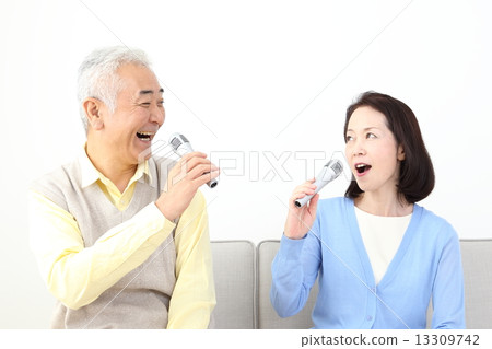 A couple doing karaoke 13309742