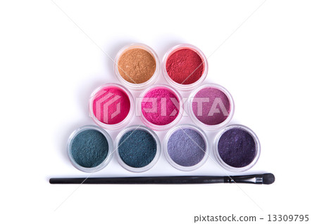 Top view of mineral eye shadows and brush Top view of mineral eye shadows and brush 13309795