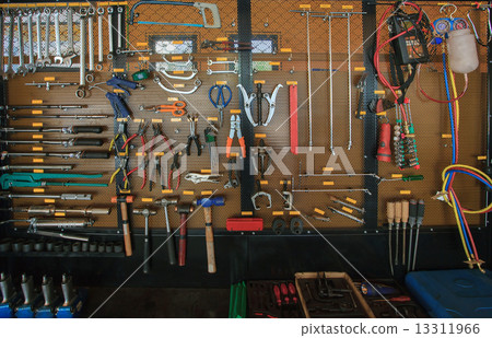 hand tool kit object arrangement on car auto service and maintenance wall  13311966