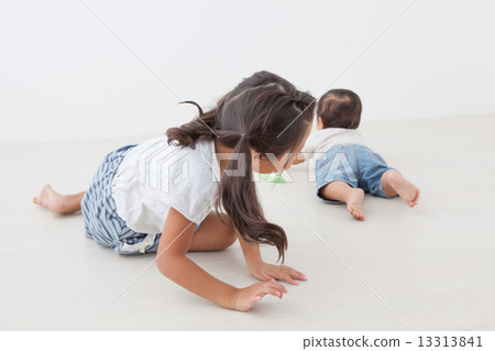 infant, slithering across the floor, older sister and younger brother 13313841