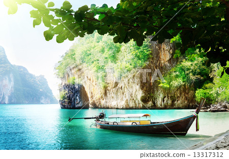 long boat on island in Thailand long boat on island in Thailand 13317312