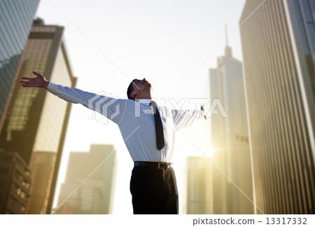 happy young businessman and big city happy young businessman and big city 13317332