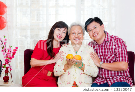 Asian senior woman and children celebrating chinese new year Asian senior woman and children celebrating chinese new year 13320047