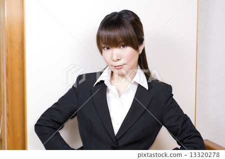 A woman in a suit with breasts A woman in a suit with breasts 13320278