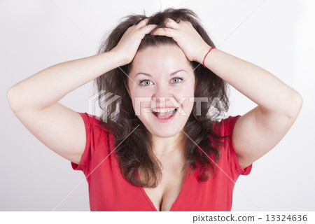 Portrait of emotional girl holding his hair. 13324636