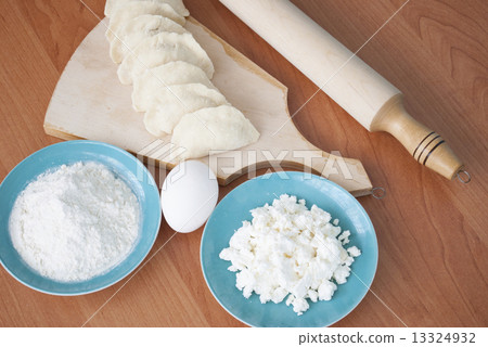 Uncooked dumplings on the cutting board Uncooked dumplings on the cutting board 13324932