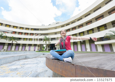 One young pan asian female student celebrate success in campus One young pan asian female student celebrate success in campus 13327875
