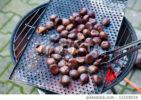 Grilling chestnuts. Grilling chestnuts. 13329019