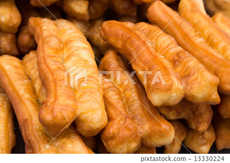 Fried bread stick or popularly known as You Tiao, a popular Chinese cuisine Fried bread stick or popularly known as You Tiao, a popular Chinese cuisine 13330224