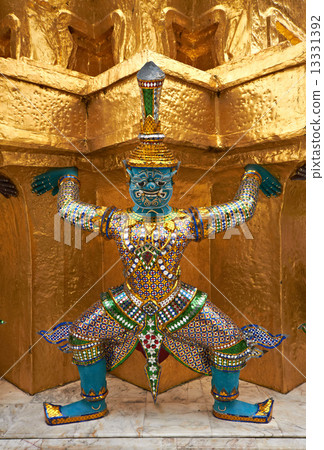 Colorful demon supporting golden stupa 13331392