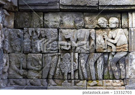 Bass-relief on the wall in Borobudur temple 13332703