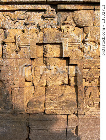 Bass-relief on the wall in Borobudur temple 13332713