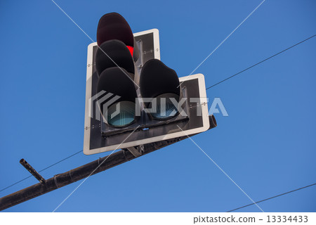 Red light traffic against the blue sky 13334433