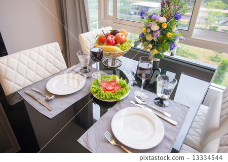 The table set and a glass of wine The table set and a glass of wine 13334544