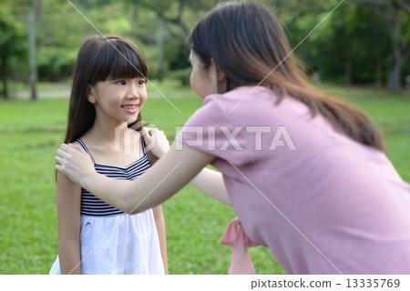 Mother encouraging her daughter Mother encouraging her daughter 13335769