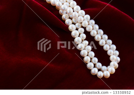 red velvet background with pearls 13338932