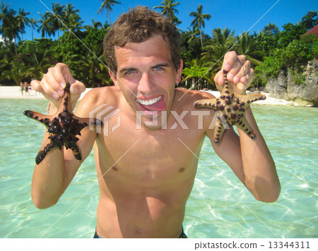 Man having fun on the beach. Man having fun on the beach. 13344311