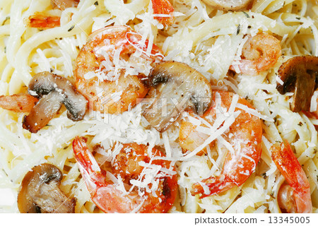 Pasta with shrimps and mashrooms on the wooden table Pasta with shrimps and mashrooms on the wooden table 13345005
