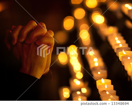 Praying in catholic church. Religion concept. 13348694