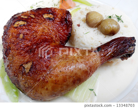 Baked chicken legs with rice and vegetables Baked chicken legs with rice and vegetables 13348703