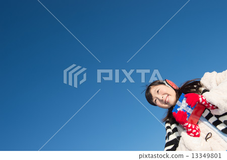 A woman giving a present A woman giving a present 13349801