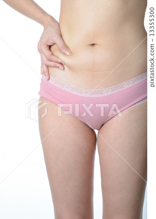 Beautiful slim woman checking her fat 13355300