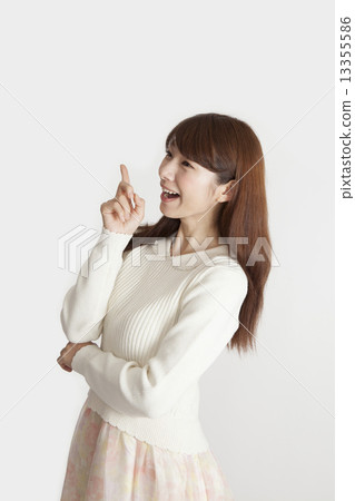 Surprised young woman looking to the left image 13355586