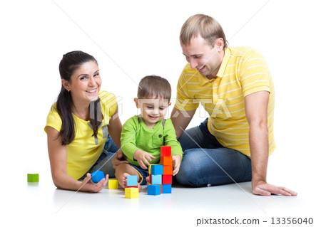 kid with his parents play building blocks 13356040