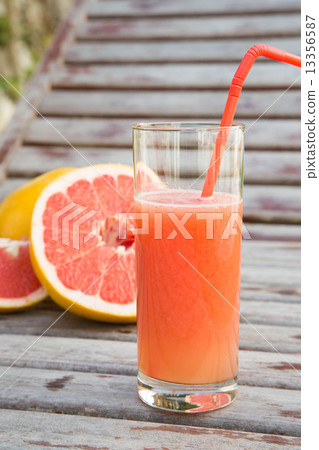 A glass of fresh grapefruit juice A glass of fresh grapefruit juice 13356587