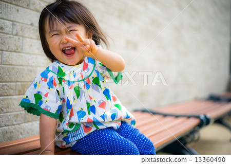 Girls playing on the bench 13360490
