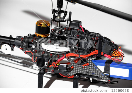 Closeup of radio controlled helicopter parts. 13360658