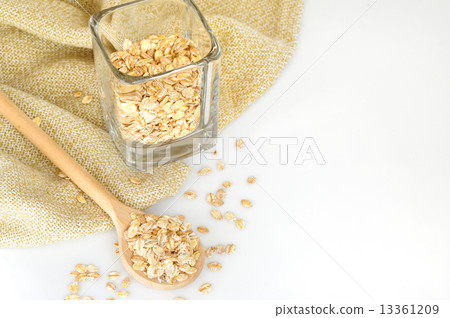 oat-flakes with a wooden spoon oat-flakes with a wooden spoon 13361209