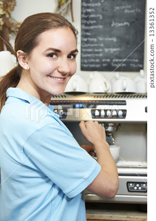 Woman In Cafe Making Cup Of Coffee Woman In Cafe Making Cup Of Coffee 13361352