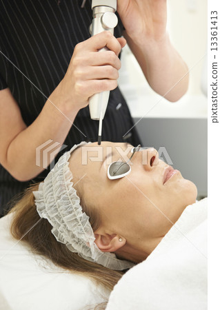 Woman Having Skin Rejuvenating Laser Treatment In Clinic Woman Having Skin Rejuvenating Laser Treatment In Clinic 13361413