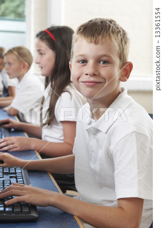Male Elementary Pupil In Computer Class Male Elementary Pupil In Computer Class 13361554