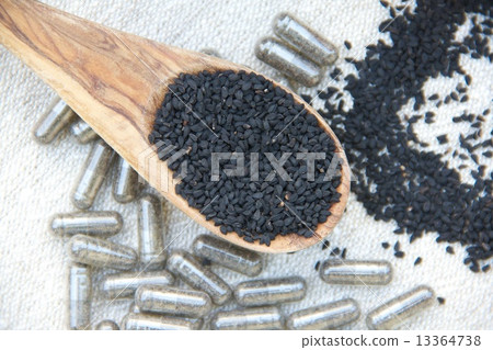 Black seeds in the olive wood spoon Black seeds in the olive wood spoon 13364738