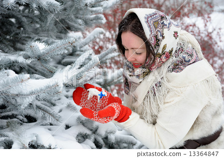 Young Russian woman in winter park Young Russian woman in winter park 13364847