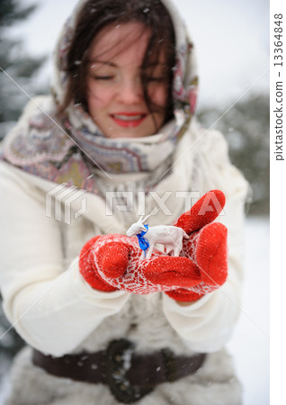 Young Russian woman in winter park Young Russian woman in winter park 13364848