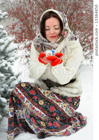 Young Russian woman in winter park Young Russian woman in winter park 13364850