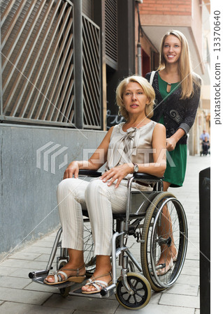 Happy woman in wheelchair Happy woman in wheelchair 13370640