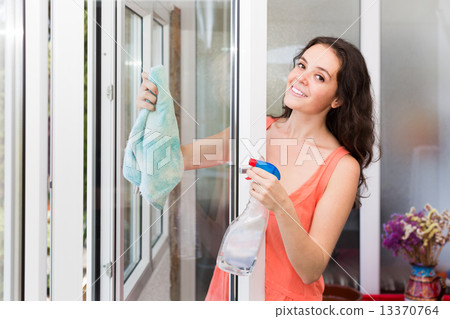 Housewife cleaning windows 13370764