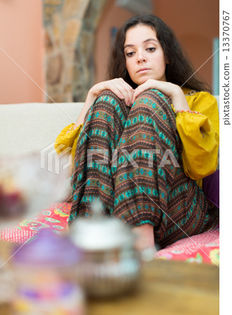 Upset girl on sofa at home Upset girl on sofa at home 13370767